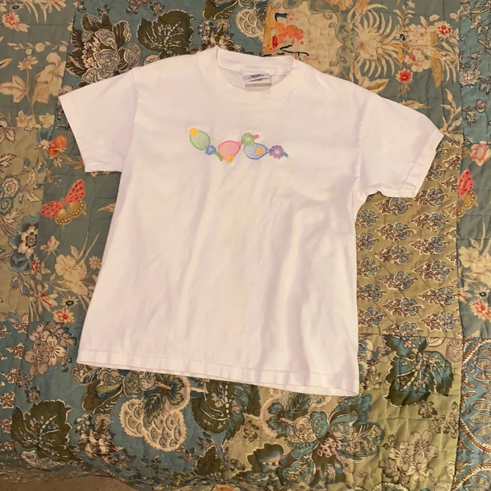 Tennis Anyone?? Girl’s white tennis shirt